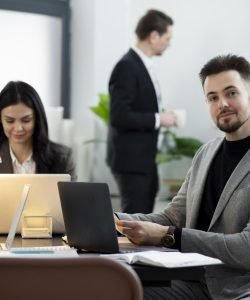 medium-shot-people-working-desk-1 (1)