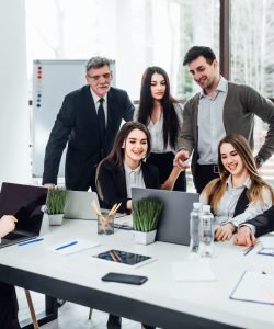 staff-meeting-group-young-modern-people-smart-casual-wear-discussing-something-while-working-creative-office-business-time-1-scaled